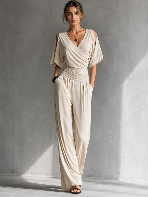 Ondina | Tuta beige con scollo a portafoglio e gamba larga